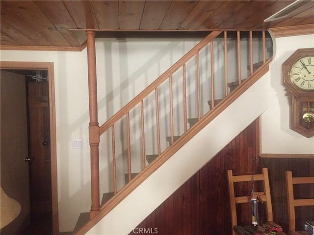 stairway with wood ceiling