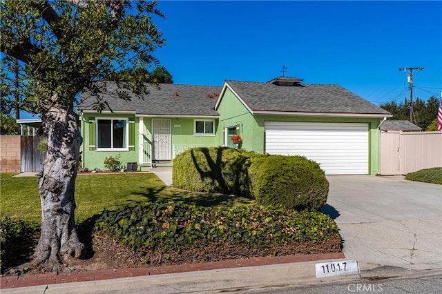 view of front facade featuring a front yard and a garage