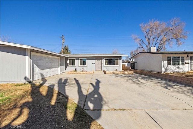 ranch-style house featuring a garage