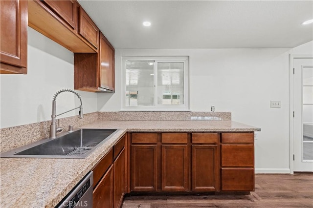 kitchen featuring dark wood-type flooring and sink