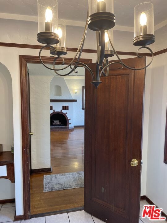 corridor featuring an inviting chandelier