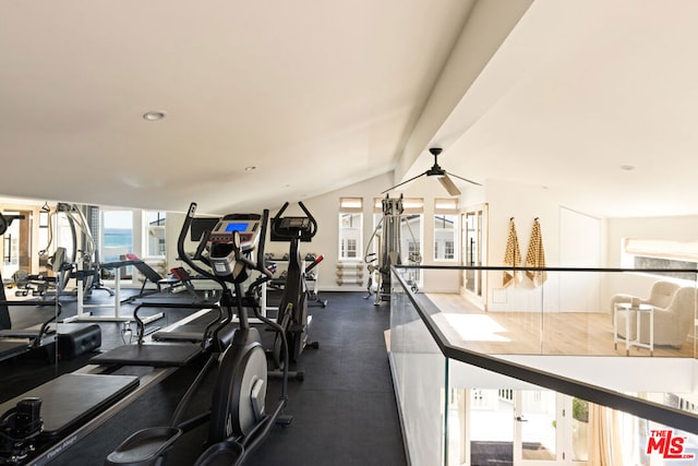 workout area featuring ceiling fan and vaulted ceiling