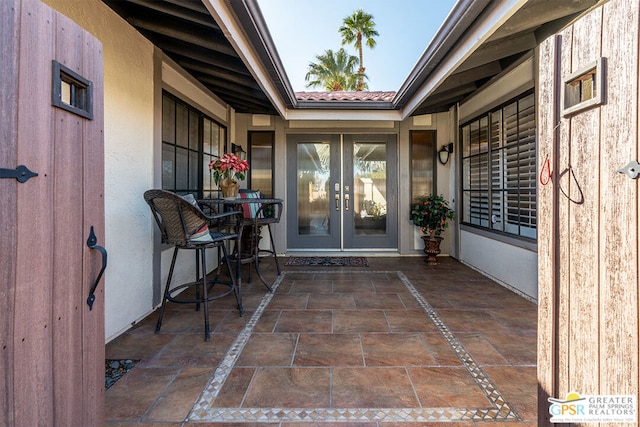 property entrance with french doors and a patio