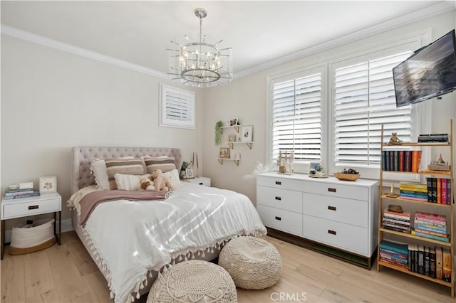 bedroom featuring ornamental molding, light hardwood / wood-style flooring, and a chandelier