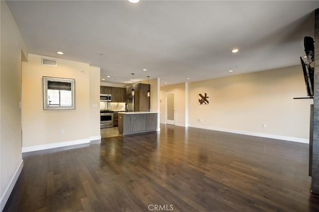 unfurnished living room featuring dark hardwood / wood-style flooring