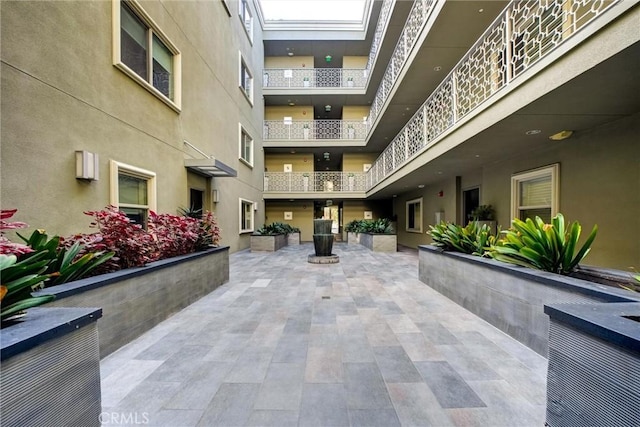 view of home's community with a patio area