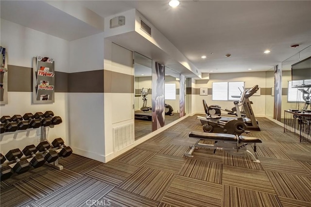 gym with baseboards, visible vents, dark colored carpet, and recessed lighting