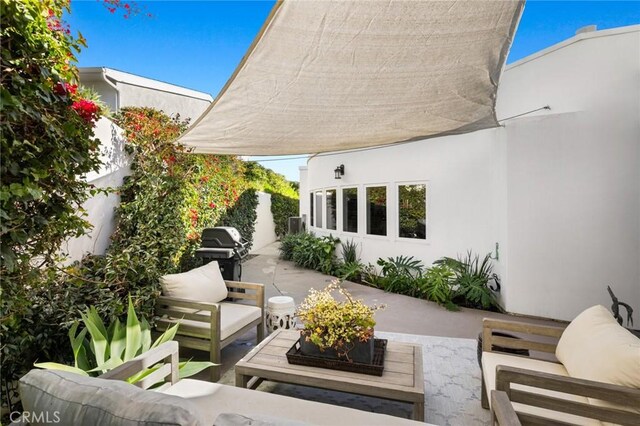 view of patio featuring an outdoor hangout area and grilling area