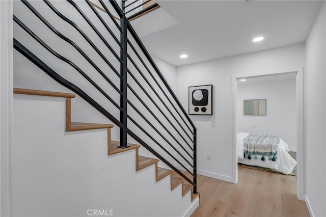 staircase featuring hardwood / wood-style flooring