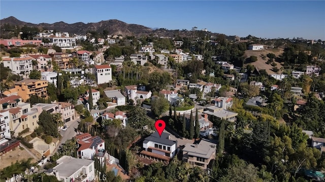 birds eye view of property with a mountain view