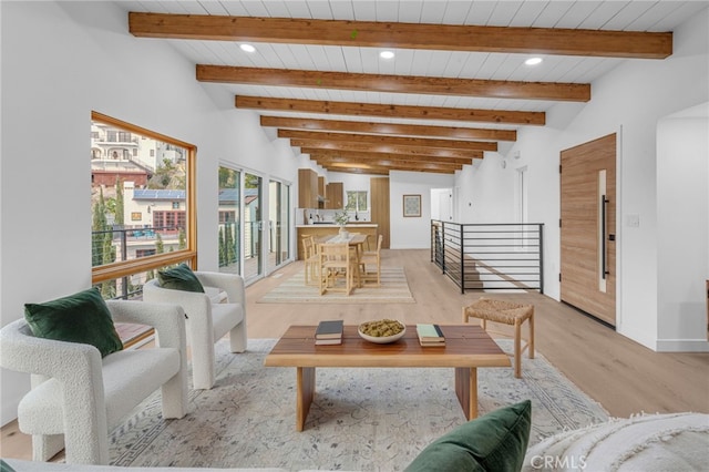 living room with wooden ceiling, vaulted ceiling with beams, and light hardwood / wood-style flooring