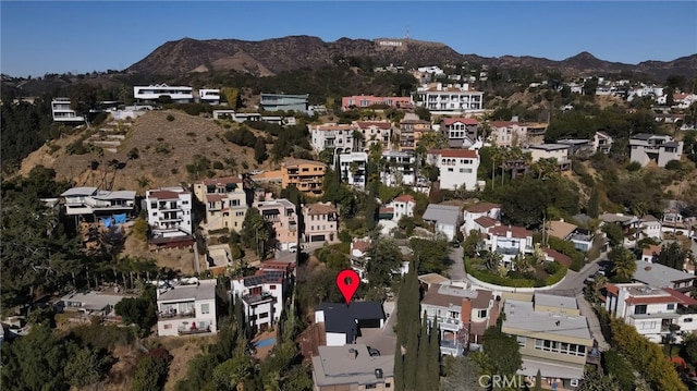 birds eye view of property featuring a mountain view