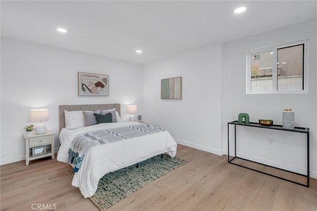 bedroom with light wood-type flooring