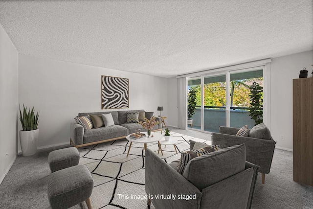 carpeted living room with a textured ceiling and baseboards