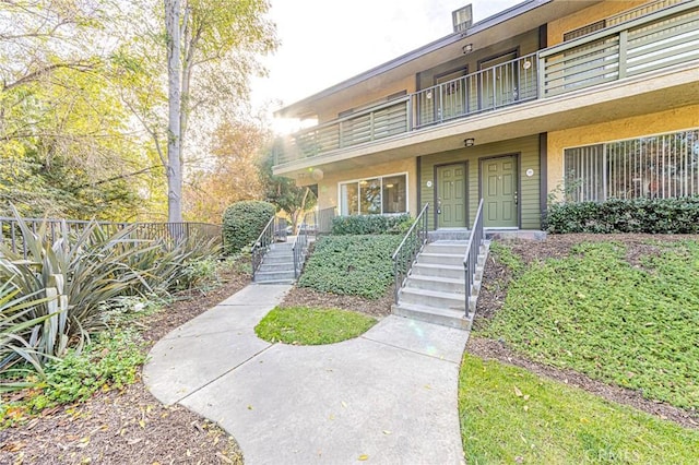 doorway to property with a balcony