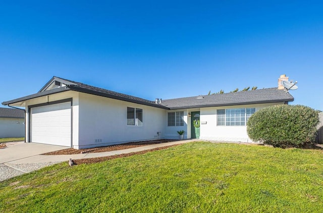 ranch-style home with a garage and a front lawn