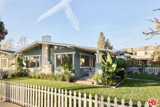 view of property exterior featuring a lawn