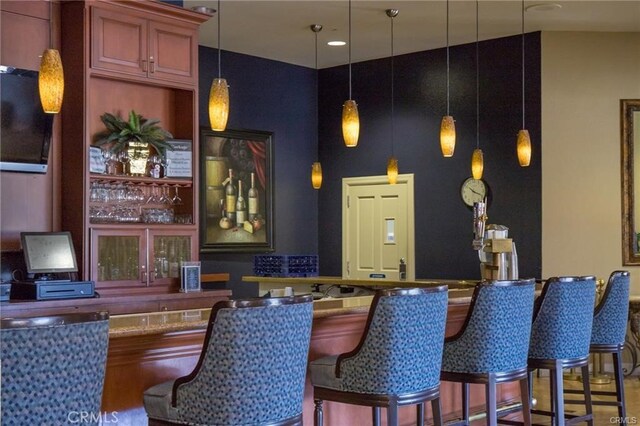 bar featuring pendant lighting