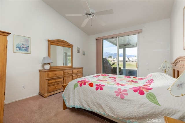 carpeted bedroom with ceiling fan, lofted ceiling, access to exterior, and a mountain view