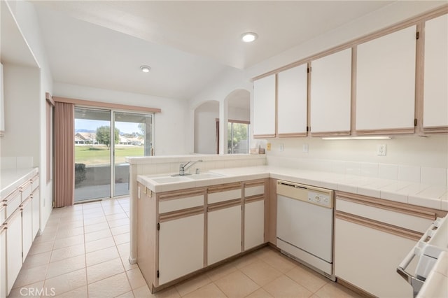 kitchen featuring white cabinetry, white dishwasher, and kitchen peninsula