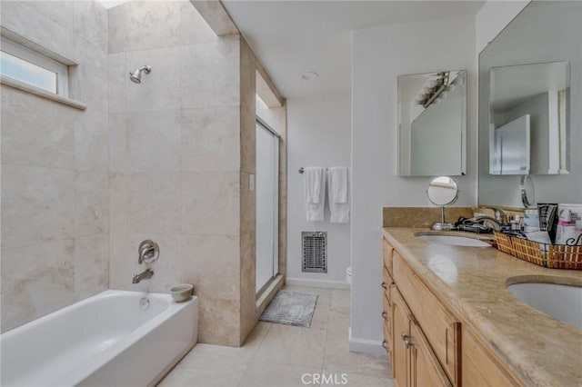 full bathroom with tile patterned flooring, shower with separate bathtub, vanity, and toilet