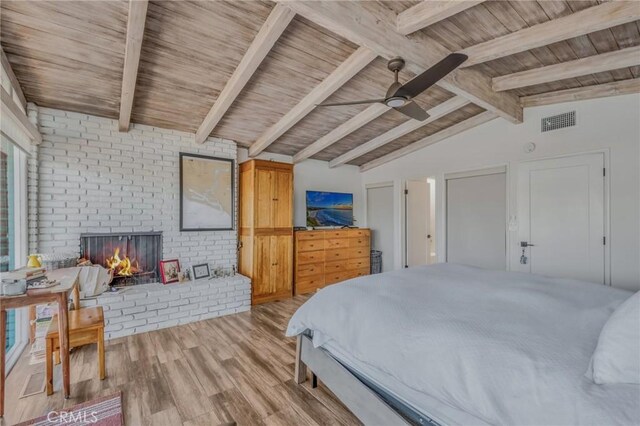 bedroom with ceiling fan, wood ceiling, and lofted ceiling with beams