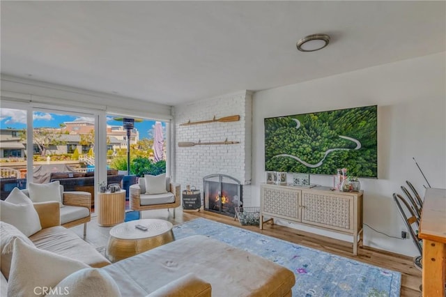 interior space with a fireplace and light hardwood / wood-style floors