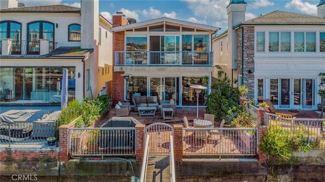 back of property with outdoor lounge area