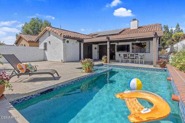 view of swimming pool featuring a patio area