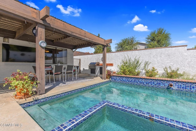 view of pool with grilling area, an in ground hot tub, and a patio area