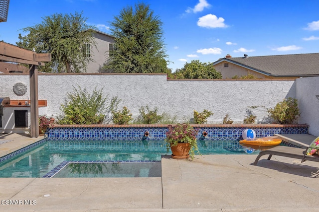 view of swimming pool featuring a patio