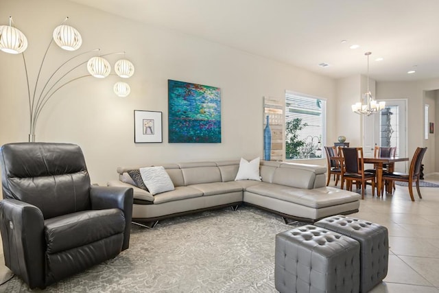 living room featuring a notable chandelier and light tile patterned floors