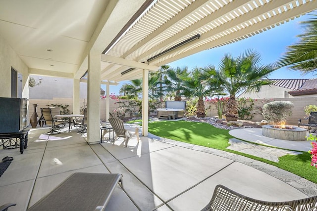 view of patio with a jacuzzi, a pergola, and an outdoor fire pit