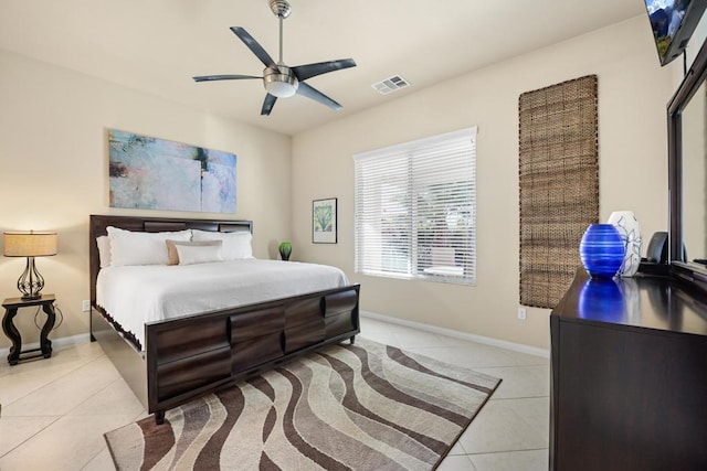 bedroom featuring ceiling fan and light tile patterned floors