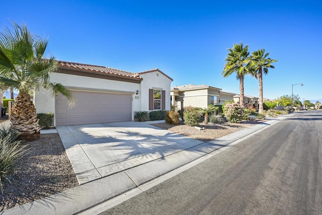 mediterranean / spanish-style home featuring a garage