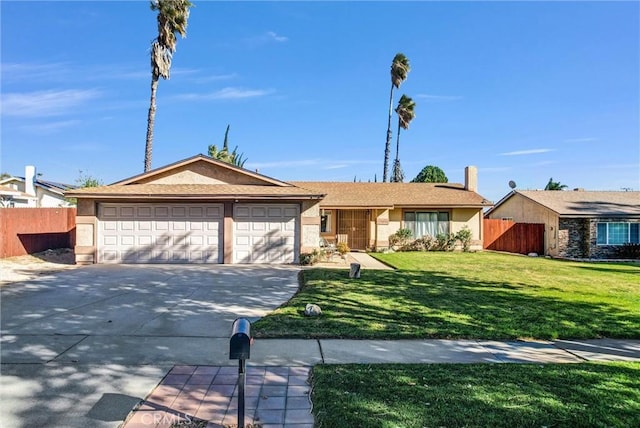 single story home featuring a garage and a front lawn