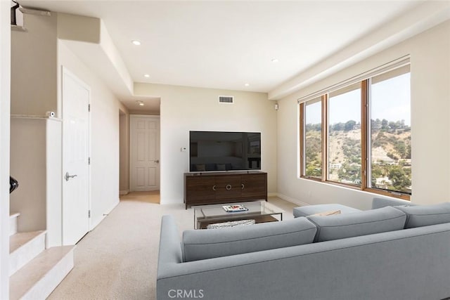 living room featuring light colored carpet