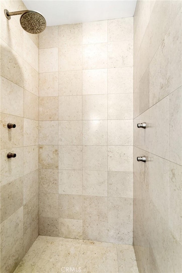 bathroom with tiled shower