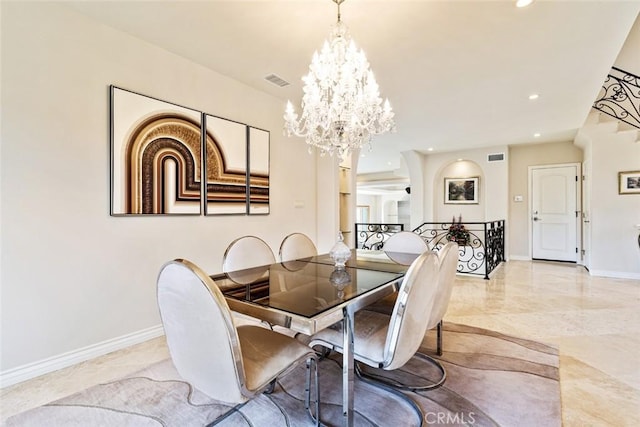 dining space with a notable chandelier