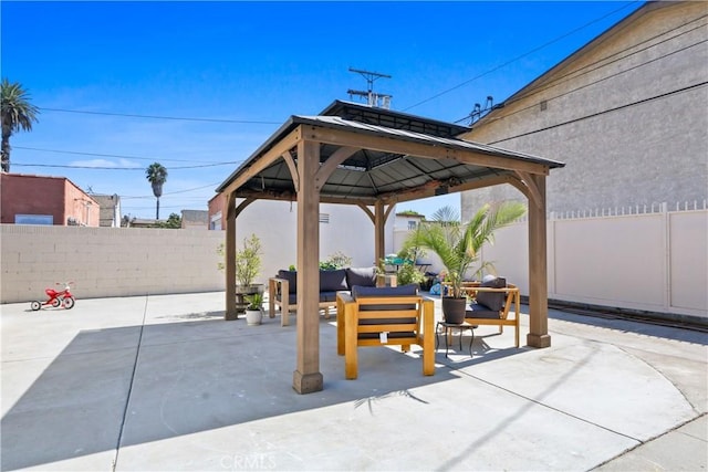 view of patio / terrace with an outdoor living space and a gazebo