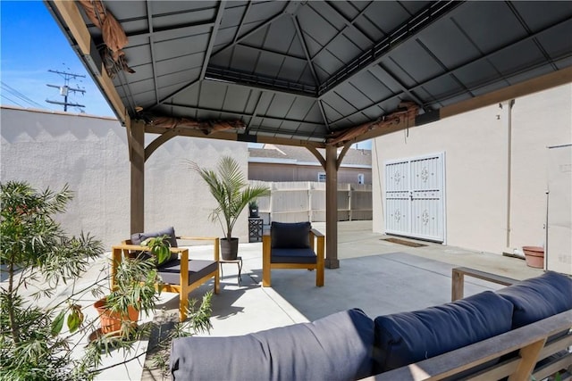 view of patio featuring a gazebo and an outdoor hangout area