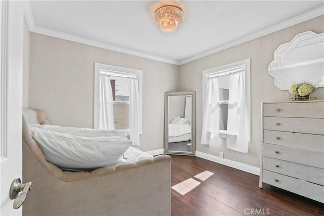 bedroom featuring crown molding and dark wood-type flooring