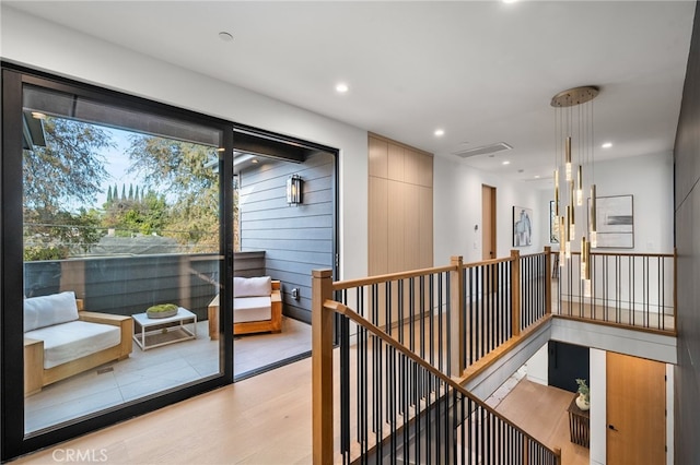 interior space featuring recessed lighting, light wood finished floors, and visible vents