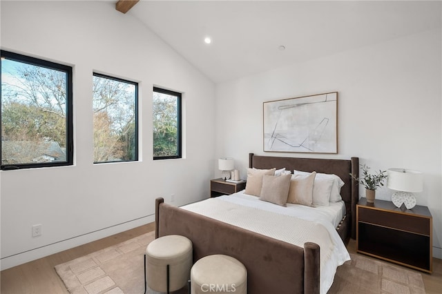 bedroom featuring vaulted ceiling with beams, recessed lighting, and light wood-style floors