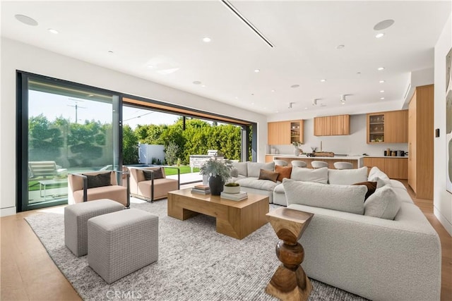 living area with recessed lighting and a healthy amount of sunlight