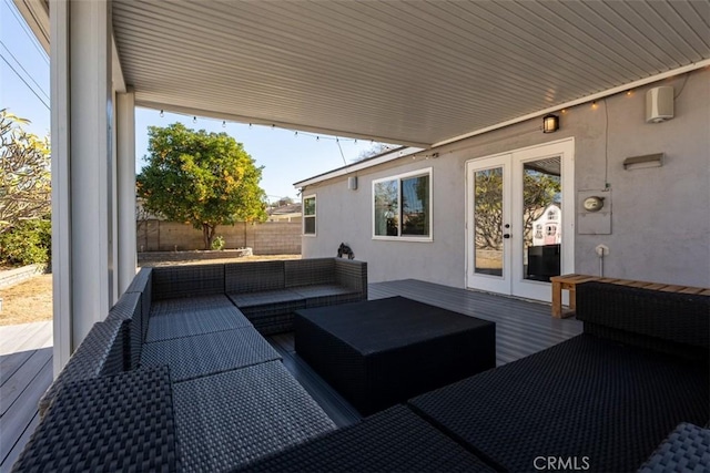 view of patio with french doors, an outdoor hangout area, and a deck