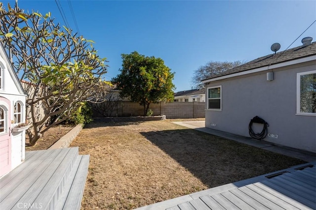 view of yard with a wooden deck