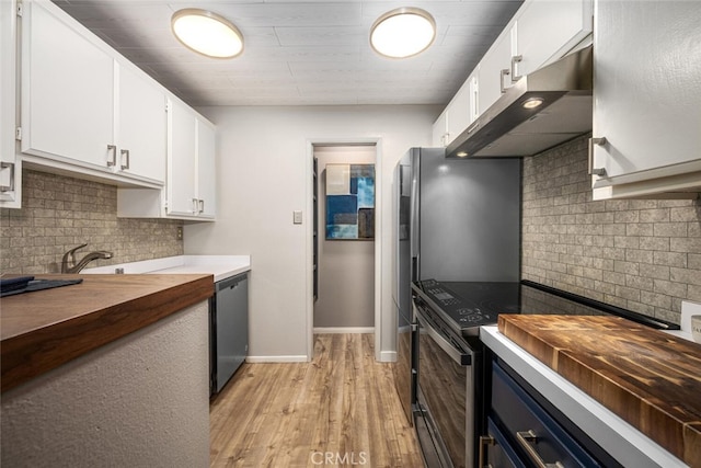 kitchen featuring stainless steel dishwasher, light hardwood / wood-style floors, wood counters, electric range oven, and white cabinets