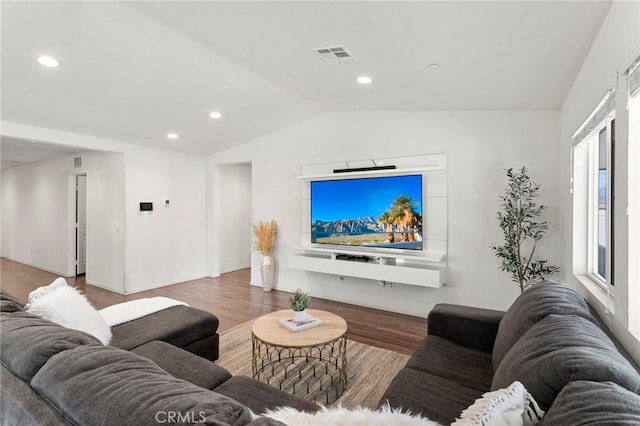 living room with lofted ceiling and hardwood / wood-style floors