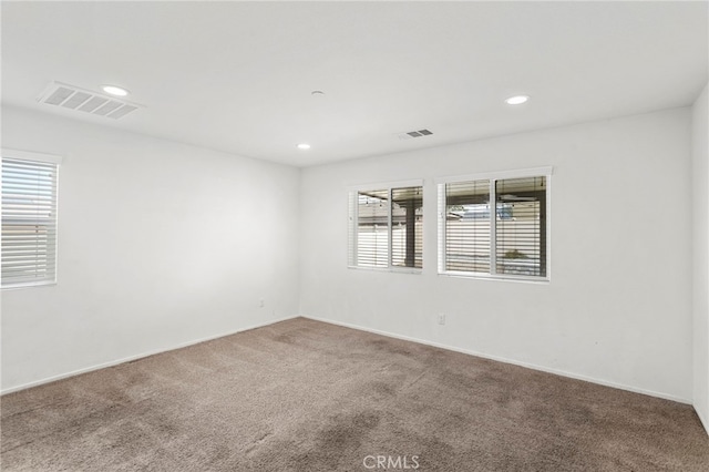 spare room featuring carpet flooring